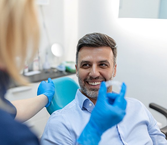 Older man learning how much clear aligners cost